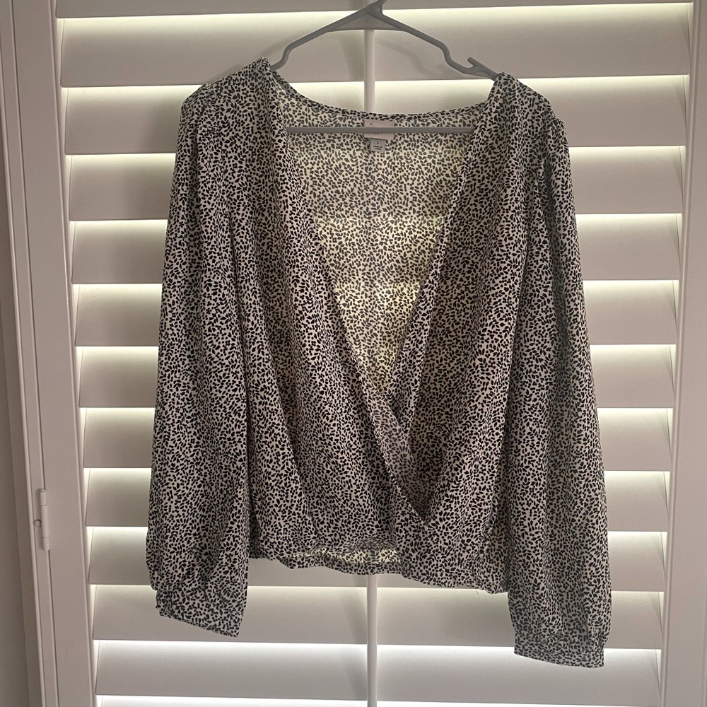 White shirt with black spots. Size L.
